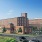a large brick building with a flag on top