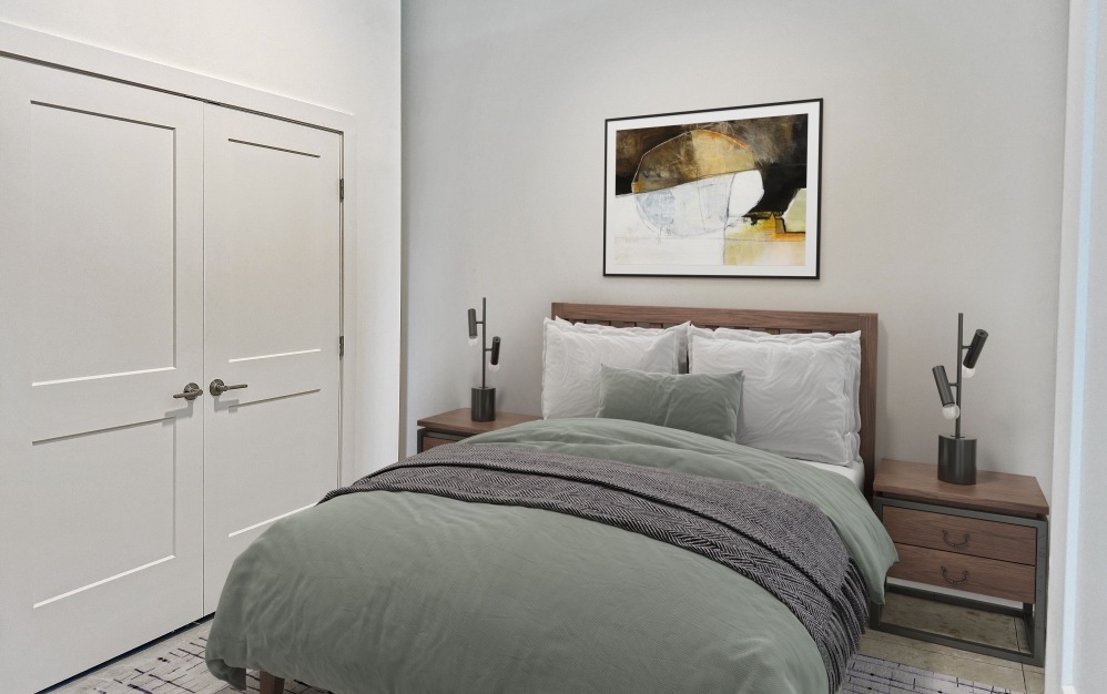 Bedroom with end tables with a picture on a wall 