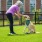 woman playing with dog