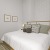 bed with lamp on stand