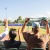 People cheering at a local baseball game