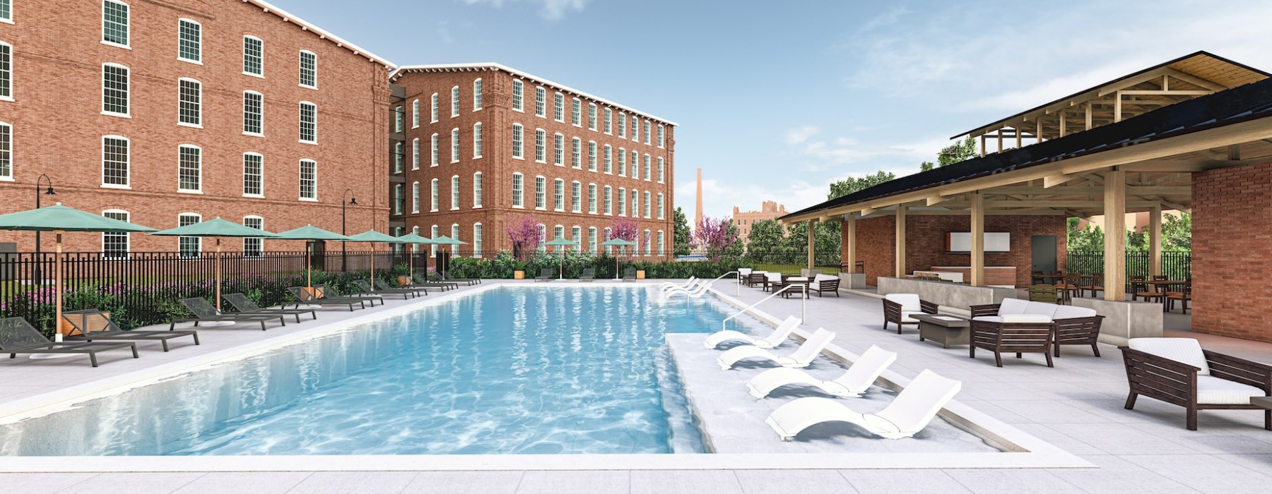 Swimming pool with cabanas at The Lofts at King Mill Augusta loft apartments