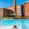 pool with lounge chairs and plants